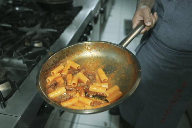 pot with pasta on the fire stove cooking