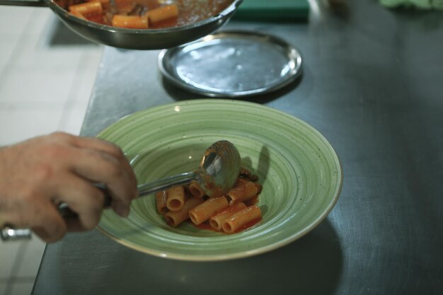 pot with pasta on the fire stove cooking