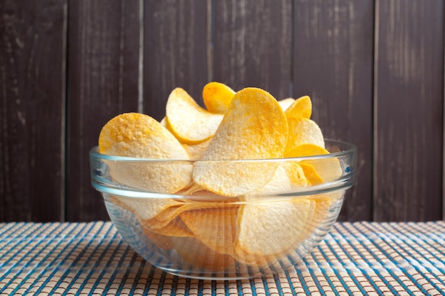 Potato chips in bowl on a table