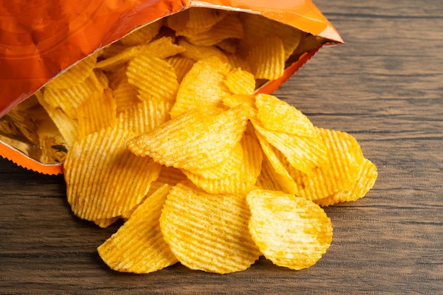 Potato chips delicious bbq seasoning spicy for crips thin slice deep fried snack fast food in open bag
