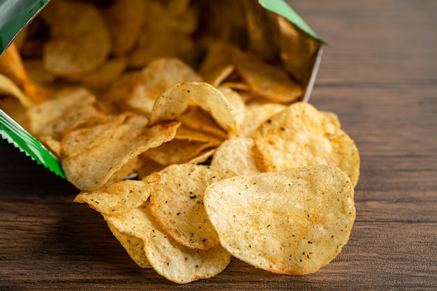 Potato chips delicious spicy for crips thin slice deep fried snack fast food in open bag