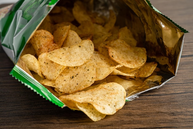 Potato chips delicious spicy for crips thin slice deep fried snack fast food in open bag