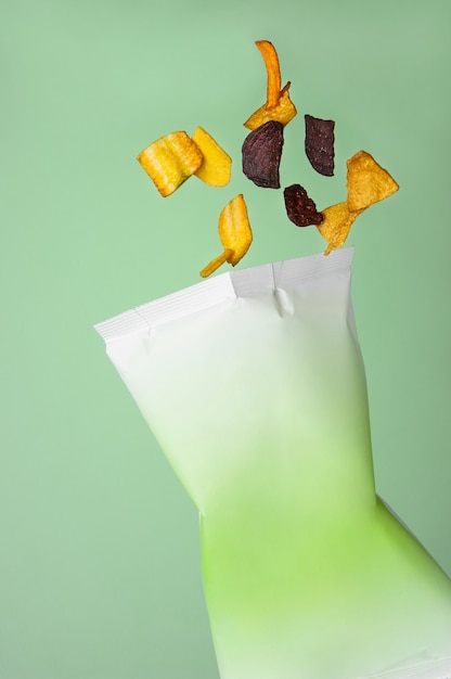 Potato chips fall in a bag, float in the air, mid-air