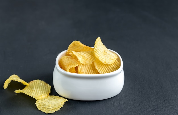 Potato chips in the glass bowl