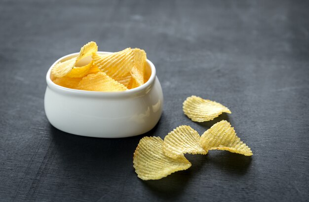 Potato chips in the glass bowl