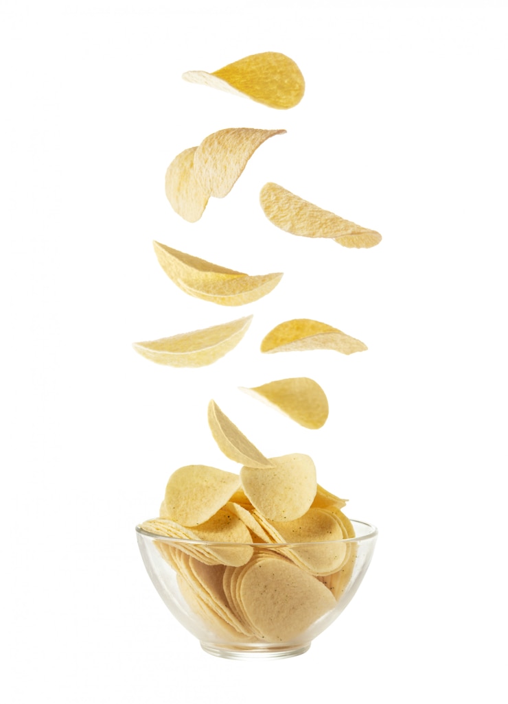 Photo potato chips in a glass plate on a white background