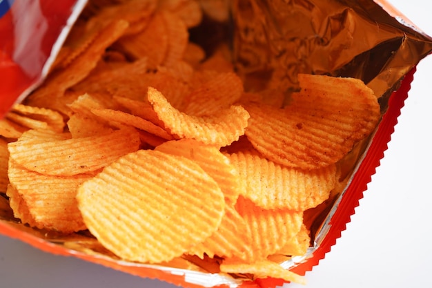 Potato chips in open bag delicious BBQ seasoning spicy for crips thin slice deep fried snack fast food