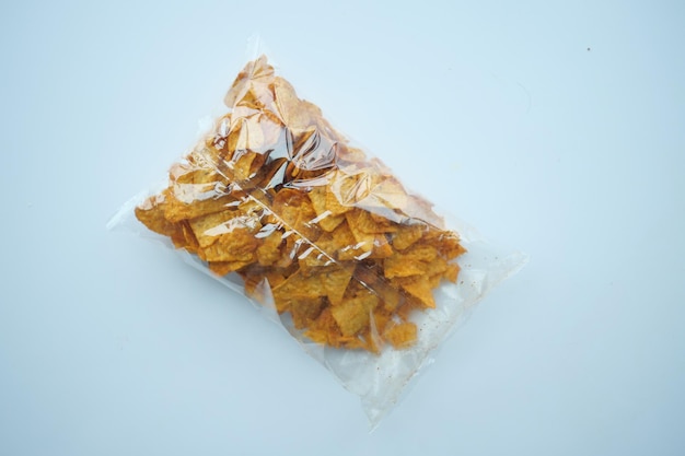 Potato chips in a plastic packet on table