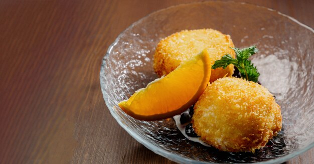 Potato croquettes - mashed potatoes balls breaded and deep fried, served with different sauce.Top view