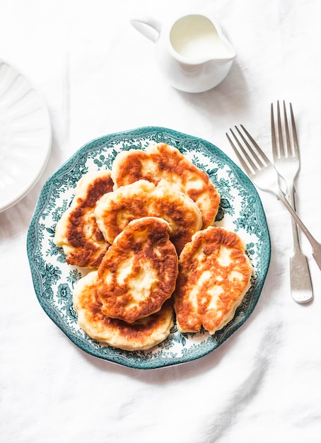 Potato fritters delicious breakfast snack on a light background top view