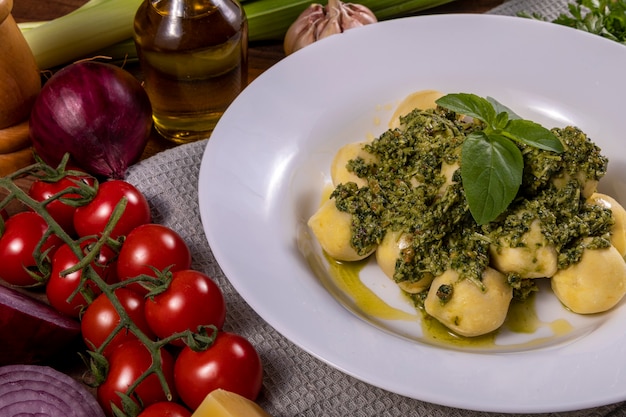 Potato gnocchi with pesto sauce.