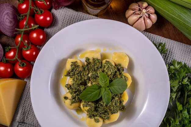 Potato gnocchi with pesto sauce.