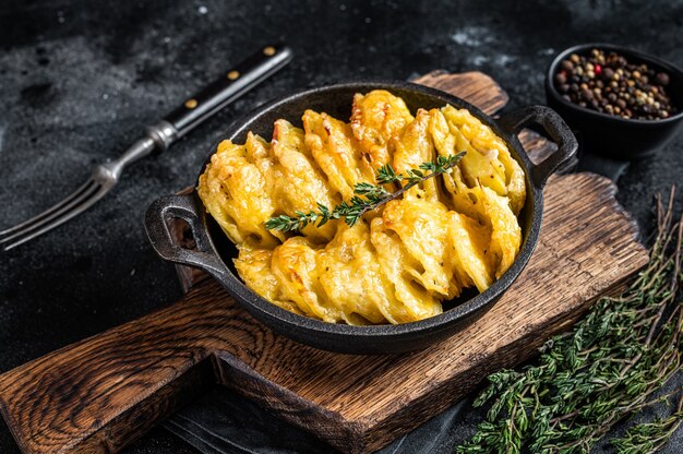 Potato Gratin Dauphinois in a pan.   Top View.