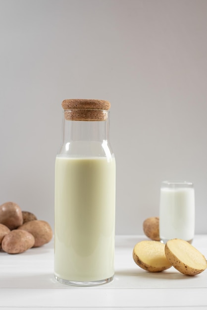 Potato milk bottle on a light background