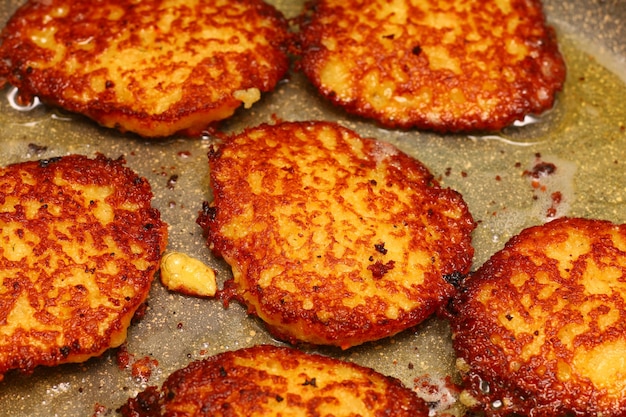 Potato pancakes in frying pan