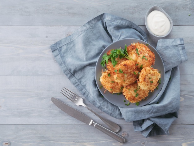 Potato pancakes on gray tabletop top view