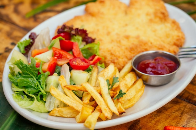 Potato pancakes and salad on tropics resort exotic spa