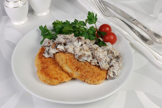 Potato patties zrazy with mushrooms and cream sauce