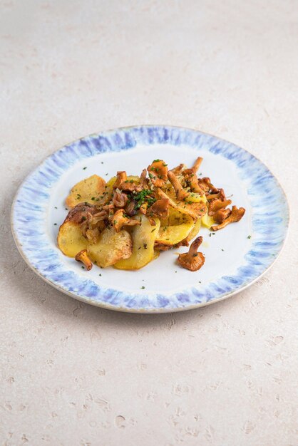 Potato recipe and white plate fried ground beef andof cream
isolated at white background