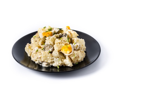 Potato salad with gherkings, egg and mustard isolated