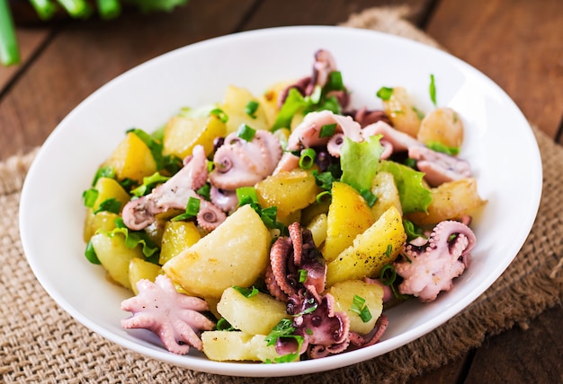 Potato salad with pickled octopus and green onions