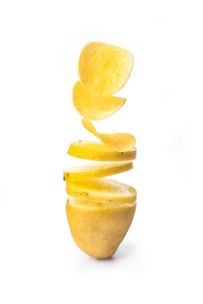 Potato slices turning into chips isolated on white background