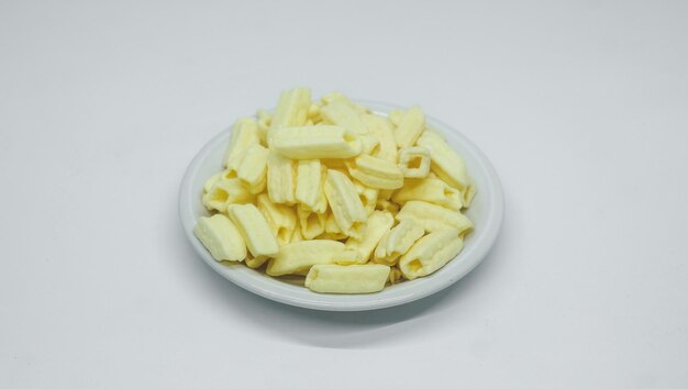 potato snacks on a plate on a white background