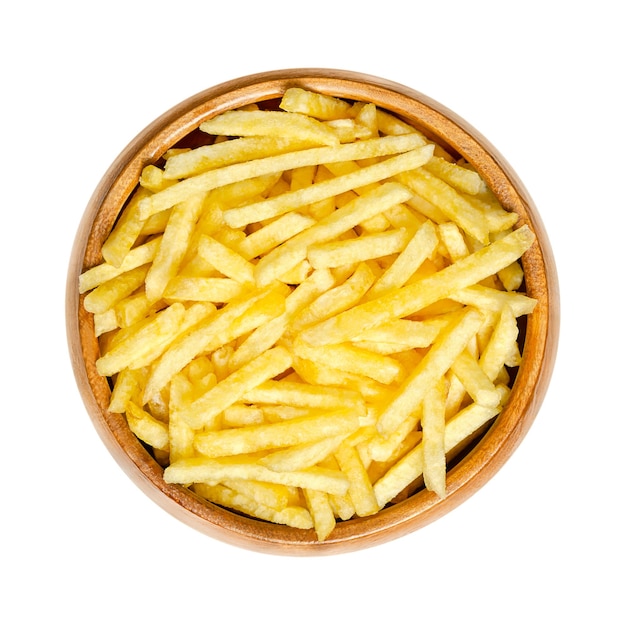 Potato sticks snack in a wooden bowl