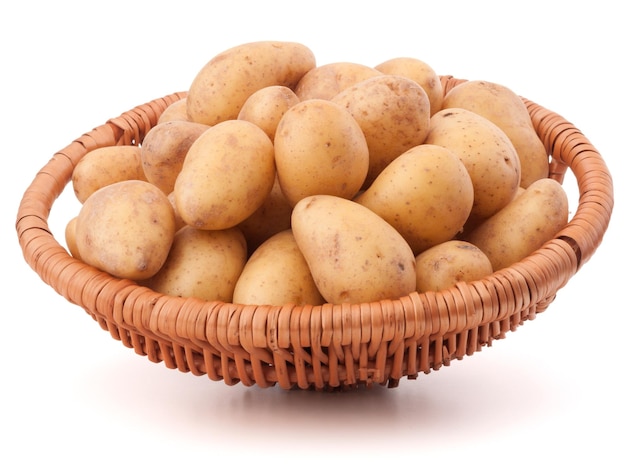 Potato tuber in wicker basket isolated on white background