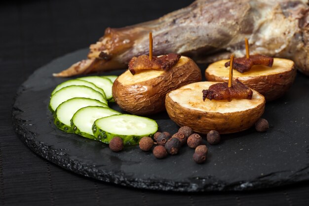 Potato wedges, peas pepper and leg of lamb