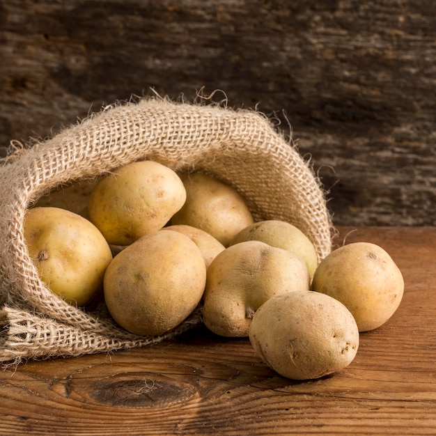 Potatoes arrangement in canvas sack bag