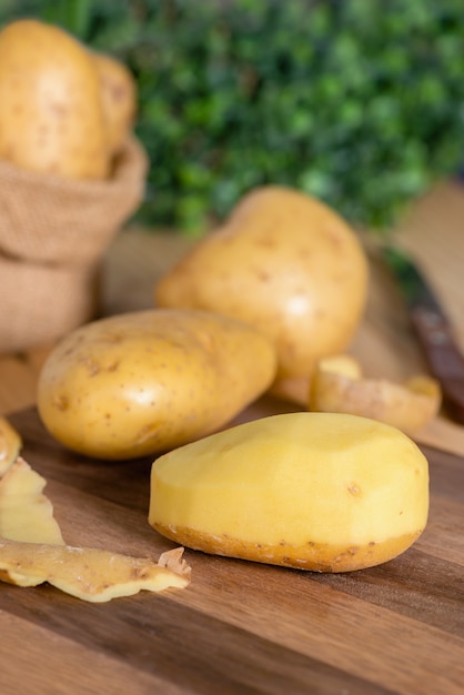 Potatoes on a cutting board sliced into pieces. Prepare for cooking.