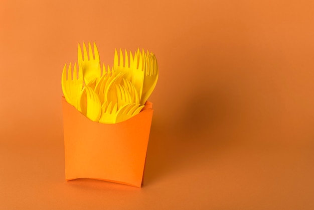 Potatoes fork have yellow with orange background pollution