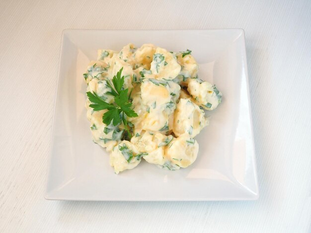 Potatoes with Alioli Aioli garlic sauce garnished with parsley and toast bread