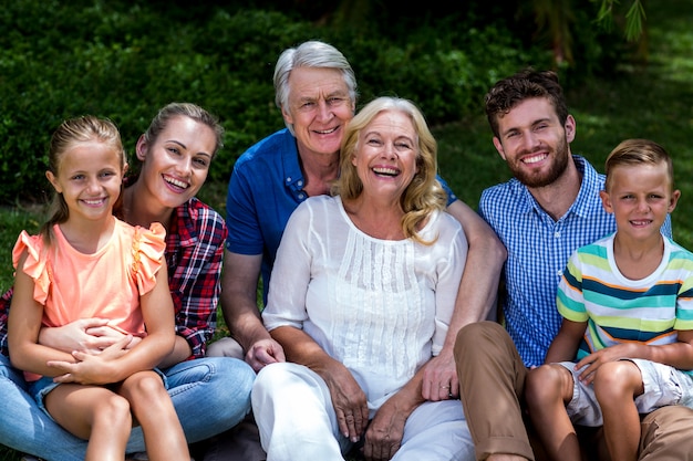 Potrait of hapy family relaxing at yard