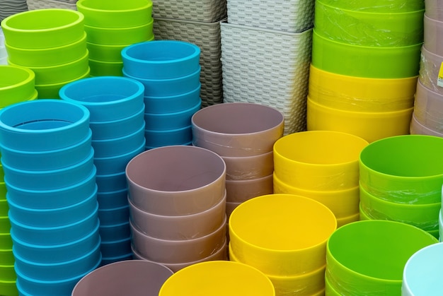 Pots of flower pots on the shelf in the store. Colorful pots