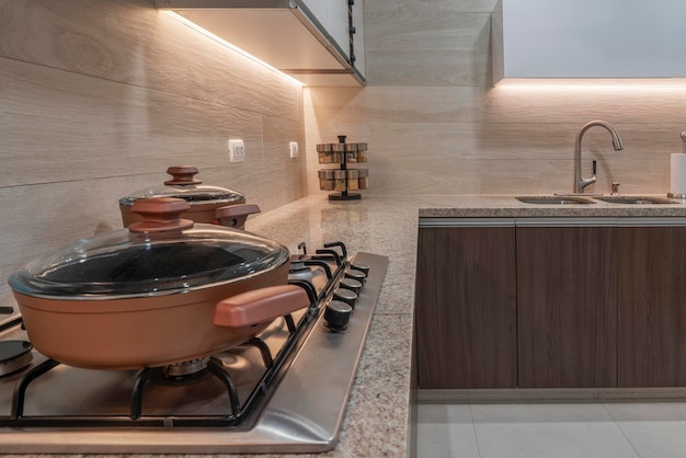 Pots and pans on the kitchen countertop at home