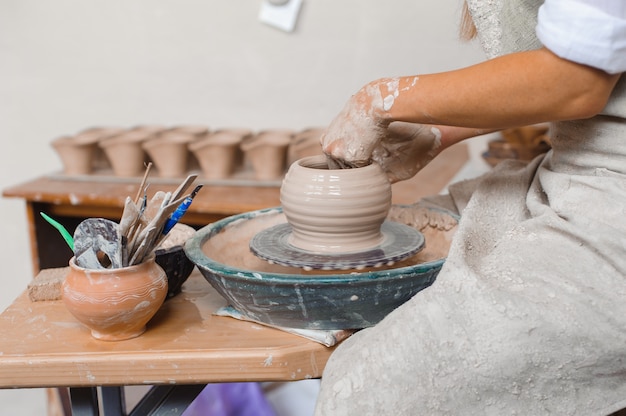 Potter teaches how make clay pot