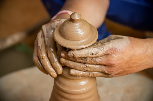 Potter at work makes ceramic dishes India Rajasthan