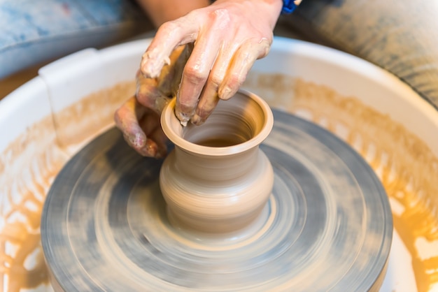 Pottering - creating a clay cup in process. Shot with a small GRIP