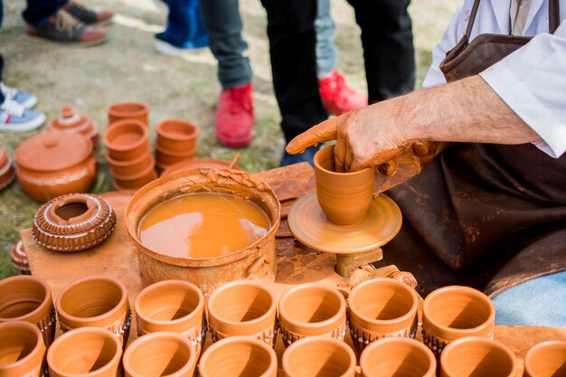 Potters hands shaping up the clay