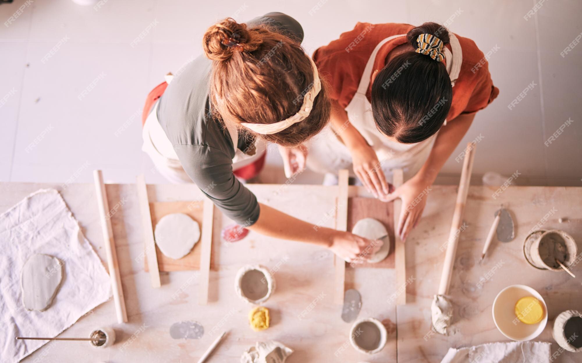 Creative, pottery and design with hands of woman in workshop studio for  molding, ceramics and art. Stock Photo by YuriArcursPeopleimages