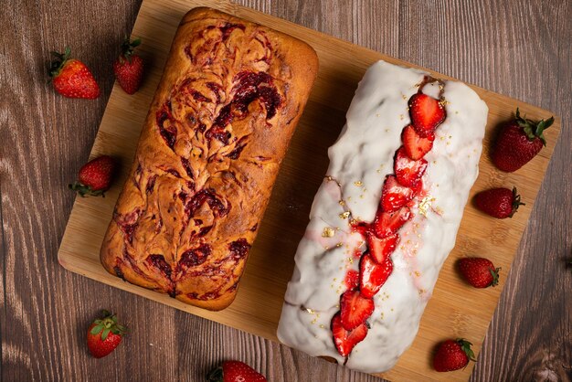 Pound cake with homemade strawberry jam Pound cake and strawberries on a wooden table