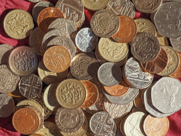 Pound coins, United Kingdom over red velvet background