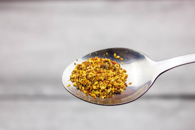 Pour dried natural organic herbs into a spoon Herbal medicine