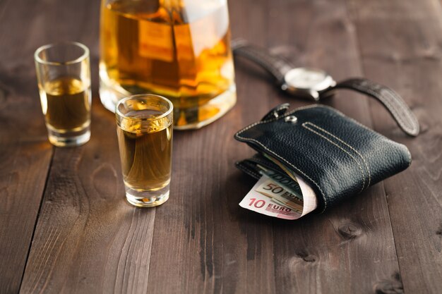 Photo pouring alcohol in shot glass