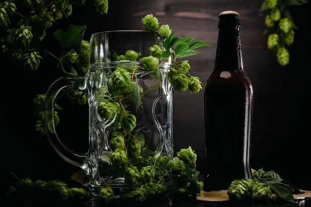 pouring beer from a bottle next to a glass