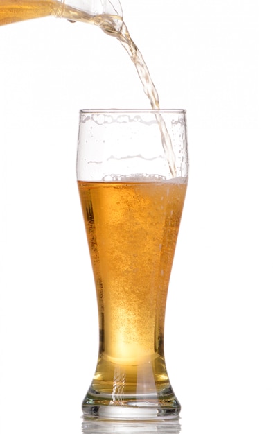 Pouring beer from bottle isolated on white