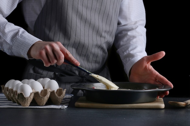 Pouring cake dough into baking tin