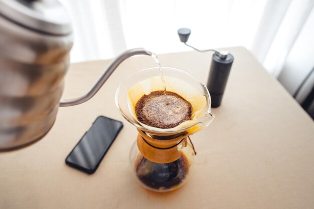 Pouring a hot water over a drip coffee